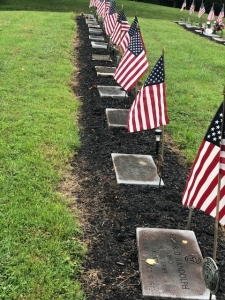 row of tombstones with flags